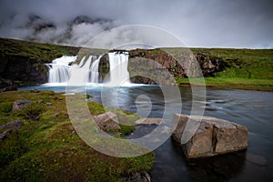 Kirkjufellfoss near Kirkjufell mountain in cloudy day ,Iceland.