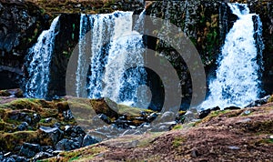 Kirkjufellfoss waterfall in the town of Grundarfjorur in western Iceland