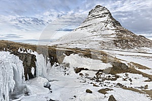 The Kirkjufellsfoss and Kirkjufell mountain in Iceland