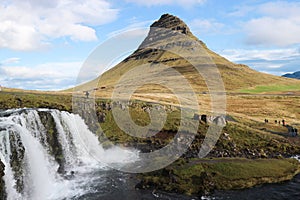 Kirkjufellsfoss waterfall and Kirkjufell mountain in Iceland