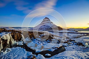 Kirkjufellsfoss Waterfall with Kirkjufell mountain at sunrise, I photo