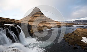 Kirkjufellsfoss waterfalls and Kirkjufell mountain Iceland