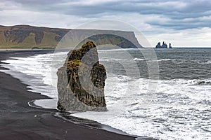 Kirkjufjara and Reynisfjara beaches in Iceland with threatening sky