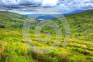 Kirkstone Pass view towards Grasmere Lake District England UK with countryside in HDR