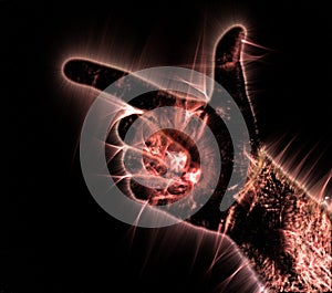 Kirlian aura photography of a glowing human male hand showing different symbols and show of hands