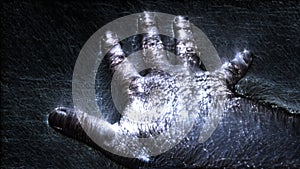 Kirlian aura videography of a male human hand showing different symbols and movement