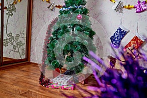 Kirov, Russia - December 17, 2018: Beautiful Christmas tree in living room decorated for Christmas. Place for photoshoot