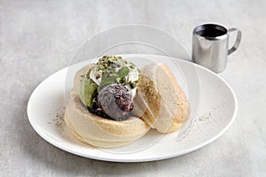 Kiseki Pancake with Matcha and Azuki Bean Paste in white plate on grey background