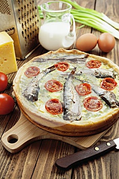 Kish with sprats and cherry tomatoes