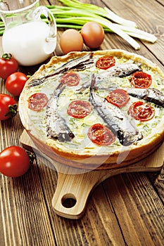 Kish with sprats and cherry tomatoes