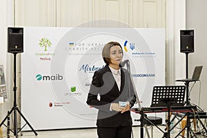 KISHINEV, MOLDOVA - April, 7 2022: President of Moldova Maia Sandu makes a speech at charity auction with paintings of ukrainian