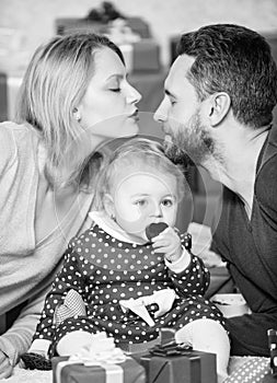 Kiss me. father, mother and doughter child. Love and trust in family. Bearded man and woman with little girl. Happy