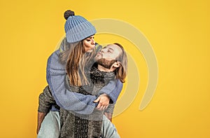 kiss me sweetie. christmas fun. knitted fashion. man and woman in sweater hat and scarf. happy family wear warm clothes