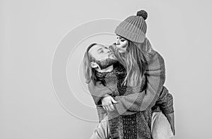 kiss me sweetie. christmas fun. knitted fashion. man and woman in sweater hat and scarf. happy family wear warm clothes