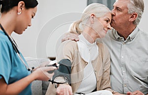 Kiss, nurse or old couple with blood pressure test consulting in hospital to monitor heart healthcare. Doctor