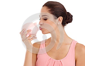 Kiss, piggy bank and woman in studio for budget, finance or investment safety. Face, container or person with money box photo