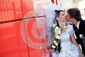 Kiss by the red wall