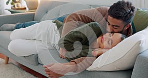 Kiss, smile and couple sleeping on the sofa in the living room of their house together. Relax, happy and calm man and