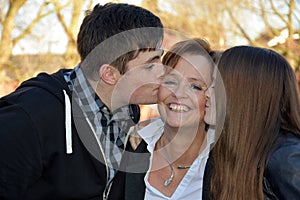 Kisses for mummy, siblings love their mother