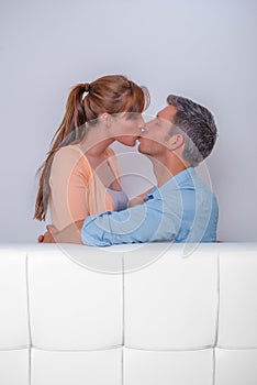 Kissing couch couple in hotel