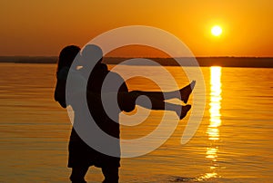 Kissing couple on the beach photo