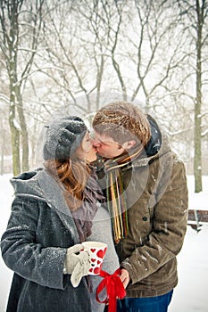 Kissing Couple While Snowing