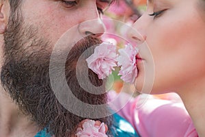 Kissing couple in spring nature close-up portrait. Passionate affectionate man and woman enjoying exciting moment of
