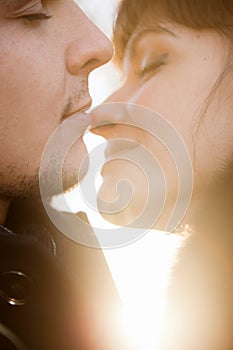 Kissing couple at sunshine