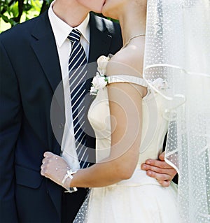 Kissing couple on wedding day