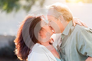 Kissing Middle Aged Couple Enjoy A Romantic Slow Dance and Kiss Outside