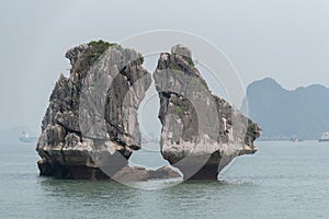 Kissing rock or Chicken rock at Halong bay northeast Vietnam is towering limestone islands topped by rainforests