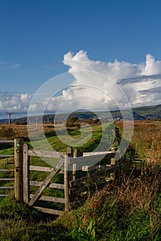 A kissing stile located by the side of the River Leri, Borth, Wales