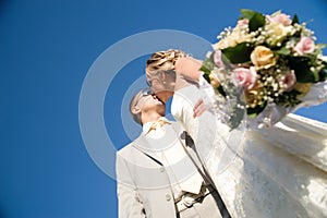Kissing wedding pair