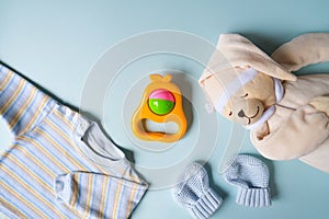 Kit of clothes and toys for newborn boy. Babyhood background.