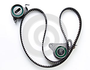 Kit of timing belt with rollers for cars isolated on white background. New car parts