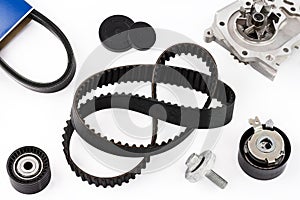 Kit of timing belt with rollers and pump on a white background