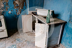 Kitchen of abandoned apartment in ghost town Pripyat in Chernobyl Exclusion Zone, Ukraine