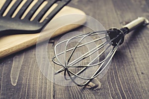 Kitchen accessories on a dark wooden background/kitchen accessories on a dark wooden background. Selective focus