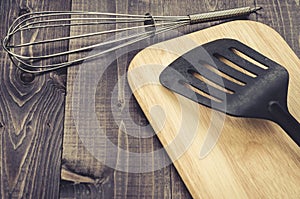 Kitchen accessories on a dark wooden background/kitchen accessories on a dark wooden background.Top view.  With copy space