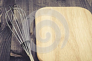 Kitchen accessories nimbus and board/kitchen accessories nimbus and board on a dark wooden background. With copy space