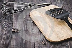 Kitchen accessories on a wooden background/kitchen accessories o