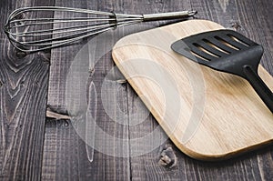 Kitchen accessories on a wooden background/kitchen accessories on a wooden background. With copy space