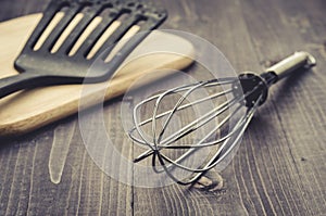 kitchen accessories on a wooden background/kitchen accessories on a wooden background. Toned. Selective focus