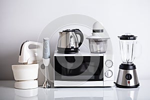 Kitchen Appliances On White Desk