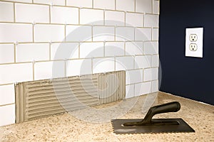 Kitchen backsplash tile installation in progress