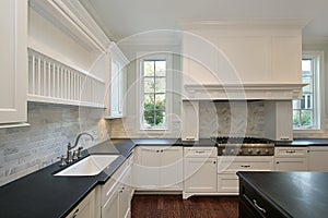 Kitchen with black countertops