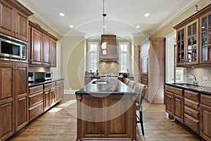 Kitchen with black granite island top