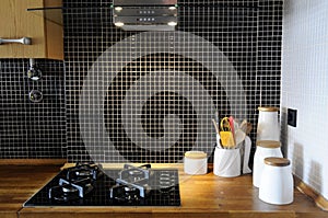 Kitchen with Black Tiles and Wooden Counter, Natural Worktop, Home Stove