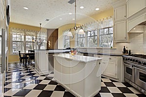 Kitchen with black and white flooring