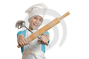 Kitchen boy holding battledore and ladle